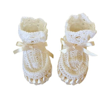 Pair of white crocheted baby booties with beige ribbons - kreassions.com